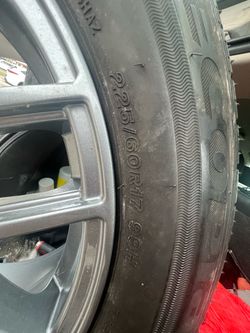225/60R17 99H Tire on Gray Alloy Wheel