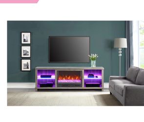 Tv stand with lights and fireplace with heat.