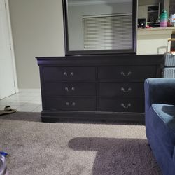 Dresser connected with a mirror