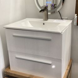Brand new 24” vanity, wall mounted, glossy white, available for pick up 