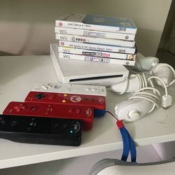 Nintendo Wii Bundle w/ 4 Controllers and nunchuks, Wii Fit Board, 7 Games