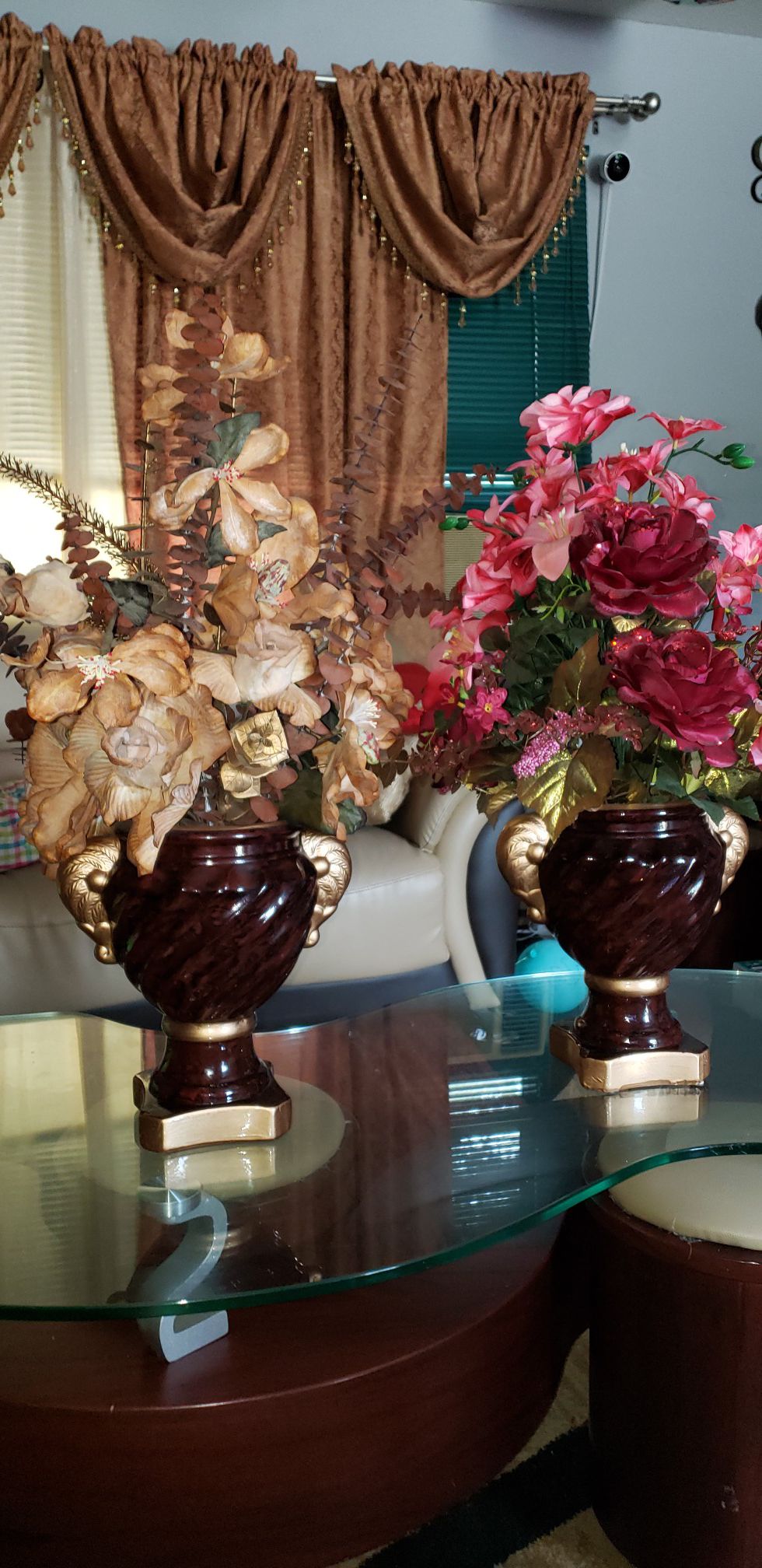 Artificial flower arrangement with vase.