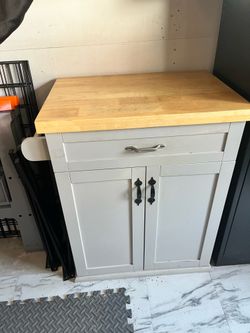 Butcher block island cabinet with towel rack