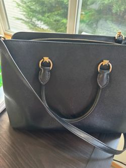 ‏black purse