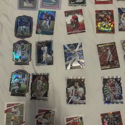 Assortment If Baseball And Football Cards