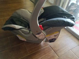 Baby carrier and car seat base