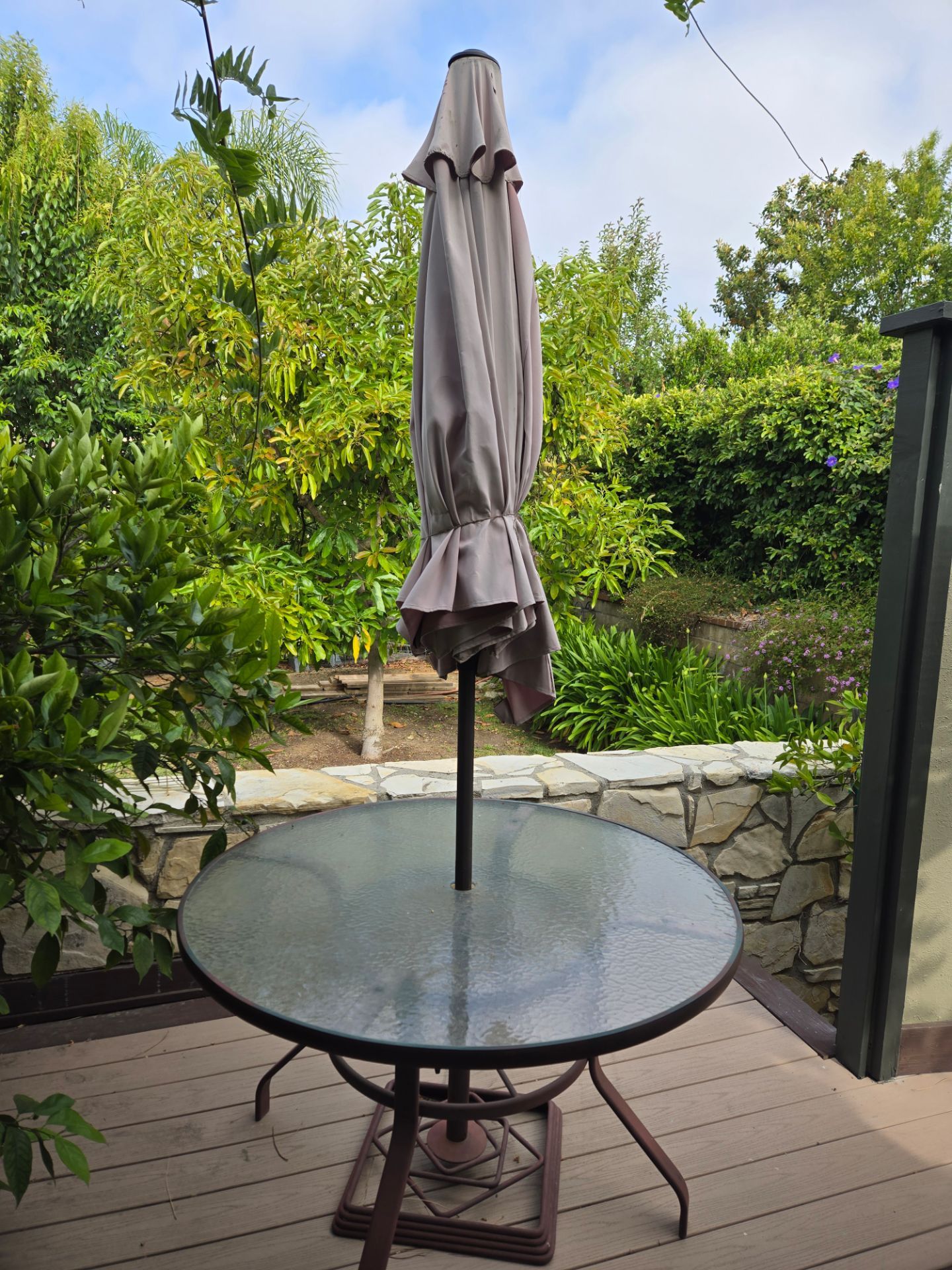FREE > Metal and glass patio table with umbrella. Umbrella will need to be replaced.