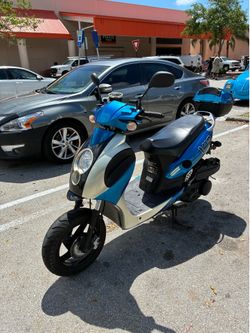 Blue and White Gas Moped Scooter
