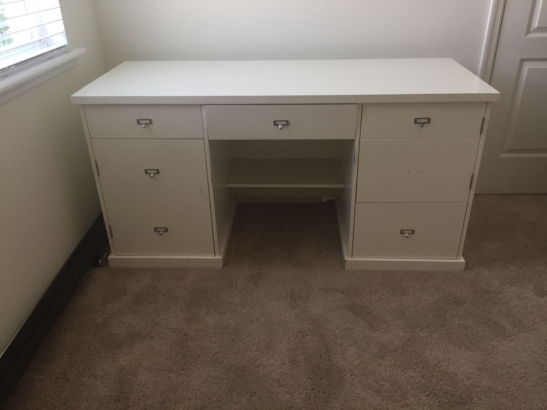 White melamine desk 59.5” wide 24” deep 30” high Pick up only Missing one small metal pull