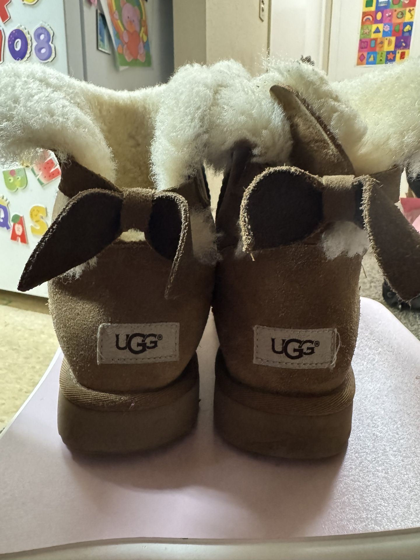  UGG Mini Bailey Bow II boots in the chestnut color