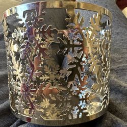 Set Of 2 Bath & Body Works silver-tone metal 3-wick candle holder sleeve with a snowflake design.