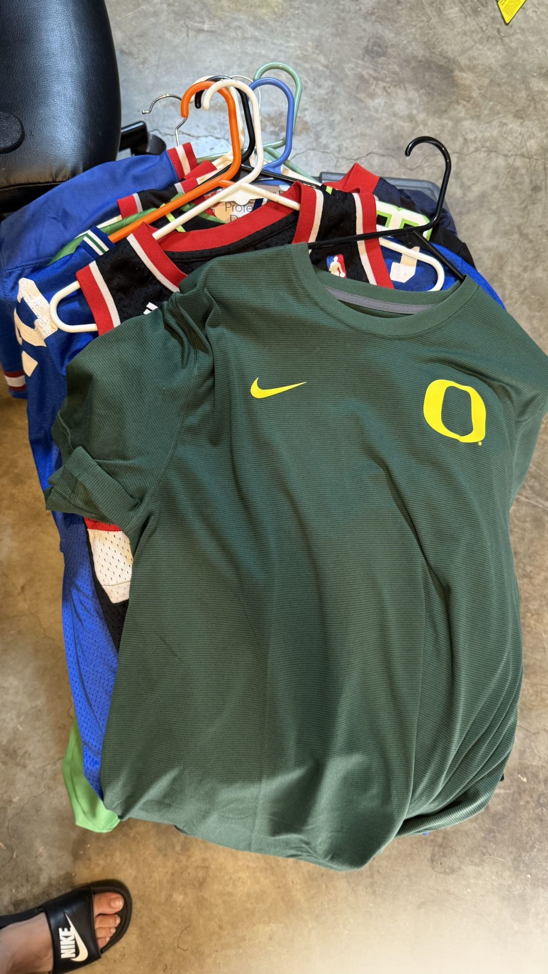 Bundle of 8–9 Sports Jerseys & T-Shirts – sizes, good condition. Includes Nike, NBA, and more.