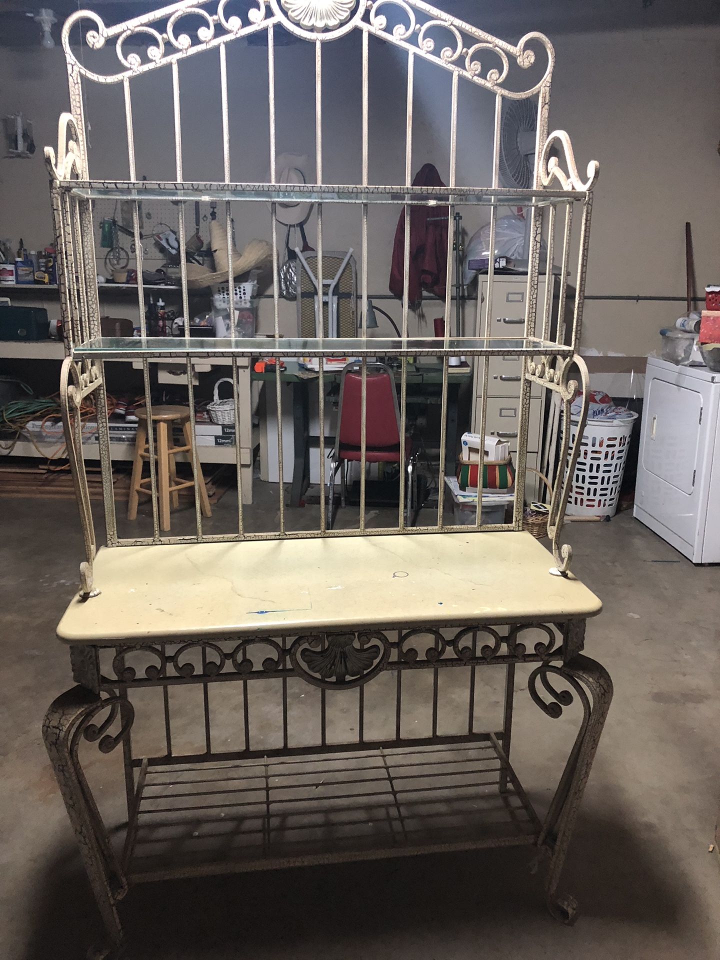 Metal bakers rack granite top and 2 glass shelves. Heavy duty
