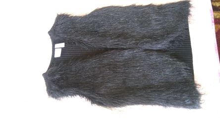 Sleeveless vest medium size.