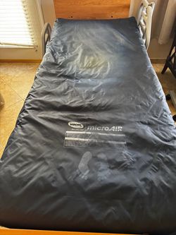 Airflow twin bed with bedside table