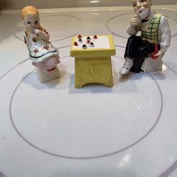 Vintage Figurines With Checkers Table