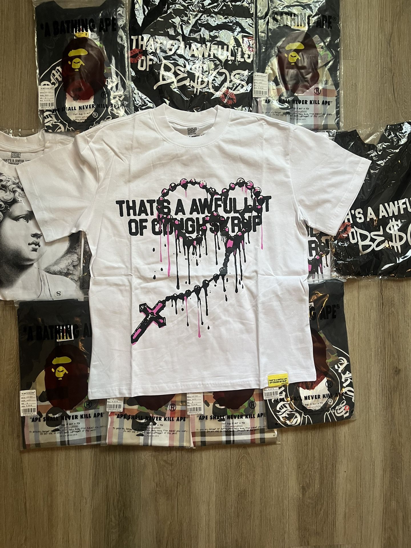 white “THAT’S A AWFUL LOT OF COUGH SYRUP” shirt medium available