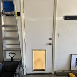 Garage door with XL Doggie door