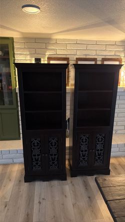 Pair of Black Wood Bookcases with Carved Doors
