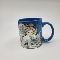 DISNEY The Little Mermaid Ariel Blue Metallic Holographic Coffe Cup Mug 
20oz. Pre-owned, very good shape, no chips or cracks. It is 4.5" tall, 
weigh