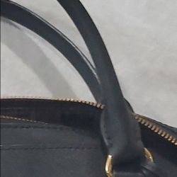 MK satchel  with crossbody strap.