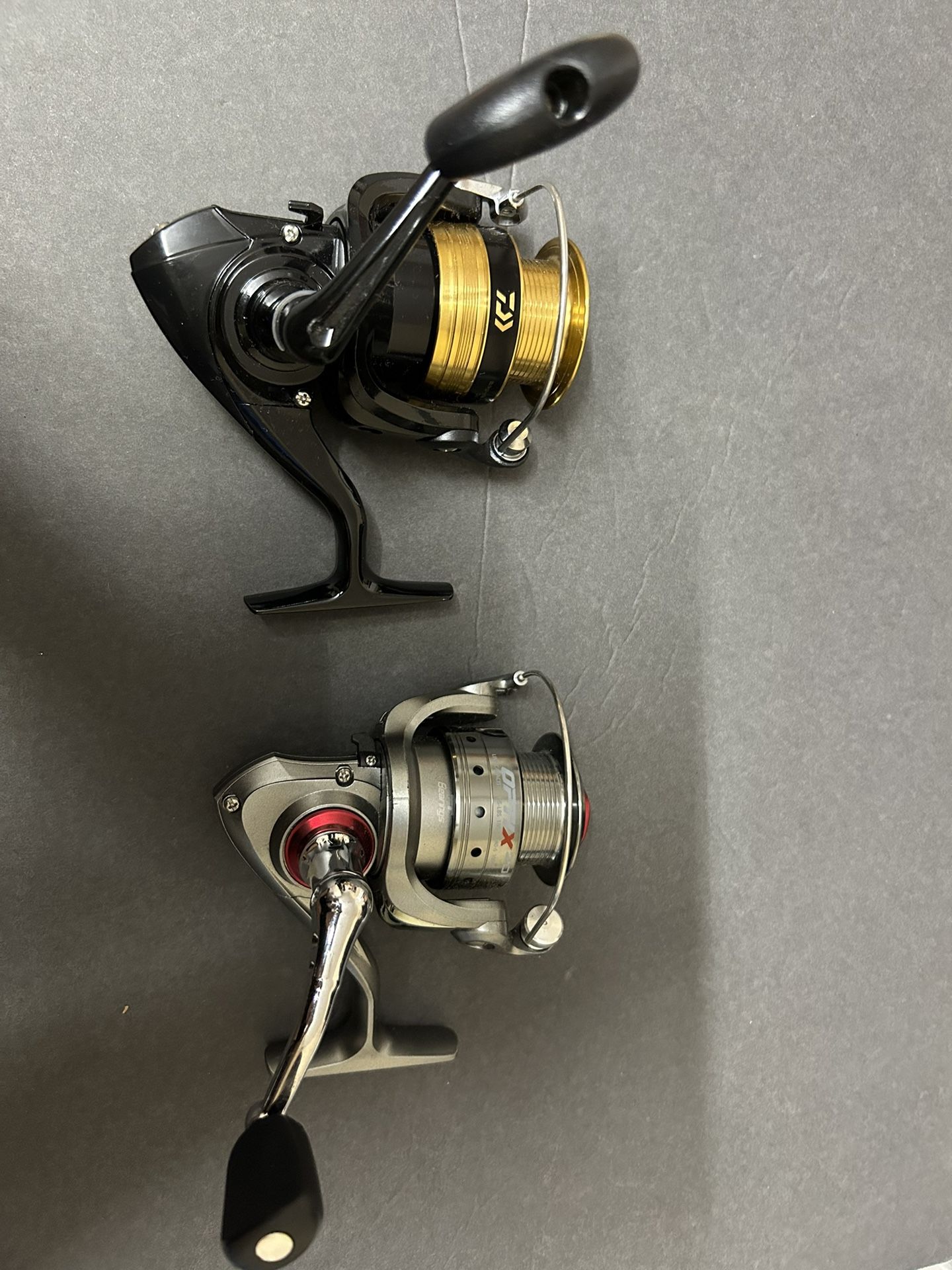 Daiwa Shock 2500B And Quantium Optix 20 Spinning Reel $40/ Both Or $25 For Each