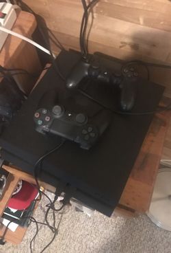 PS4 500 GB's w/ two controllers and 5 games