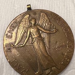 Medal Yugorskaya in a collection stand