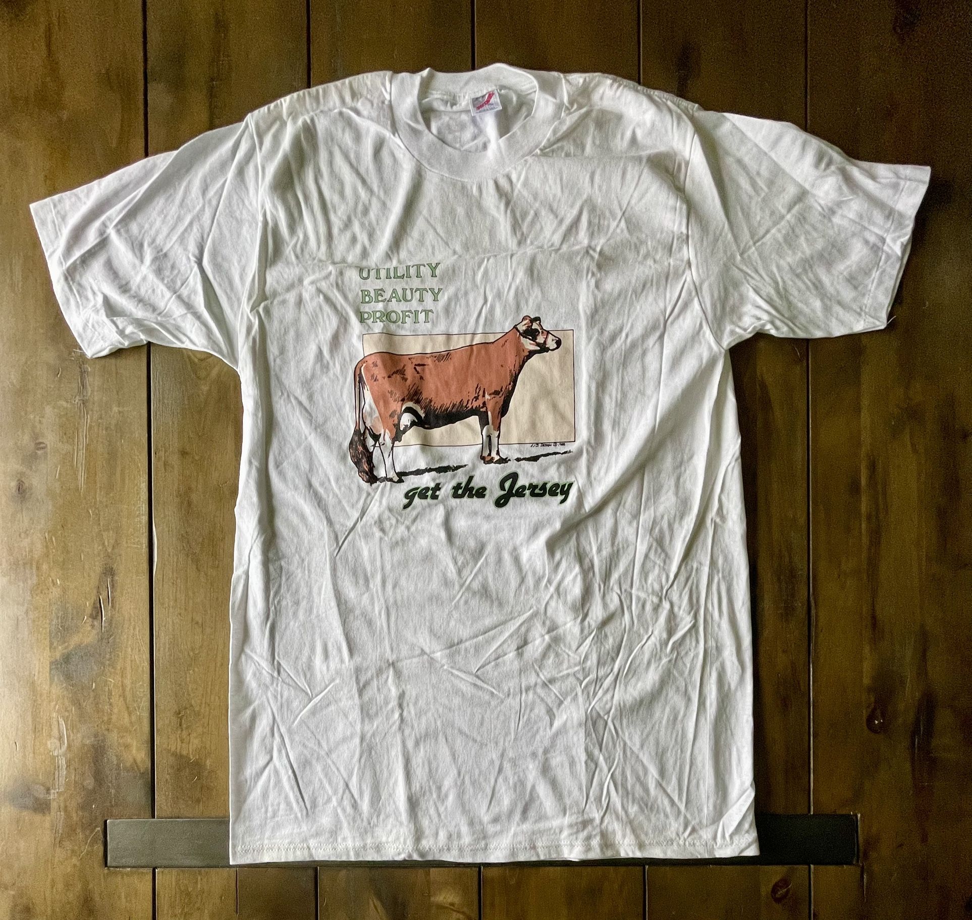 Vintage 80s Jersey Cow T-Shirt “Utility Beauty Profit” (XL) “get the Jersey”