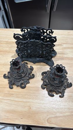 Cast iron candle holders and napkin holder. Can also be used as a mail holder.