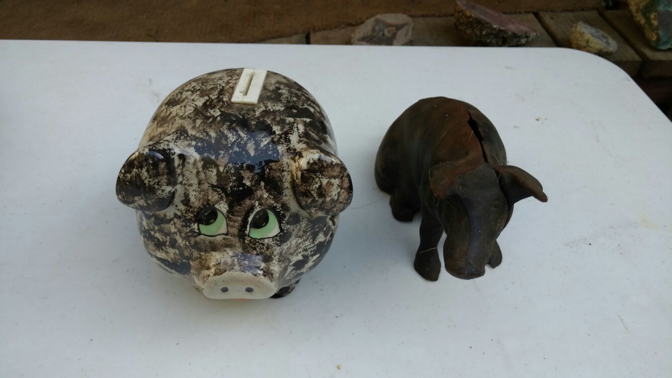 Two piggy banks 1 cast iron 1 ceramic