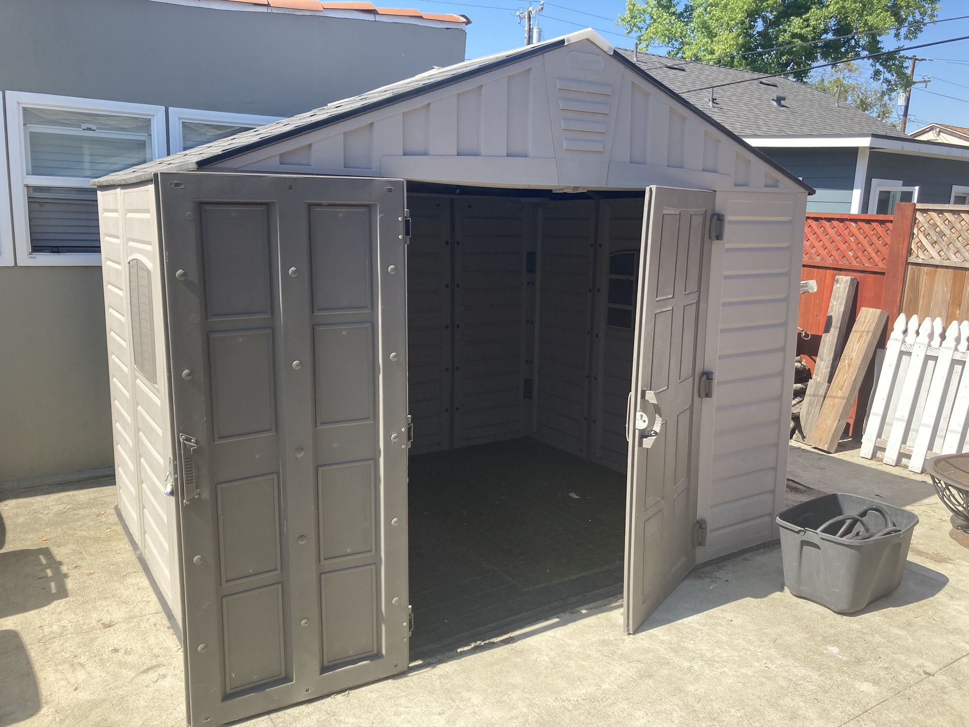 Keter Stronghold 10x8 Large Resin Outdoor Shed for Patio Furniture, Lawn Mower, and Bike Storage, Taupe