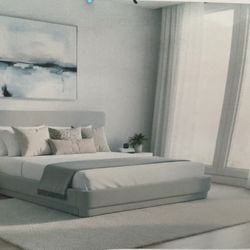 New king size platform bed White fabric upholstered.