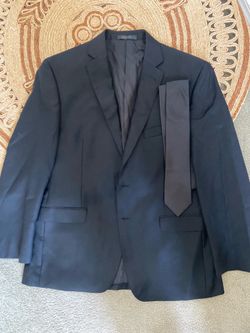 Man’s CK black suit top with tie (size 42)