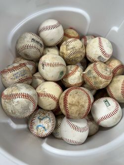 80 used baseballs with container