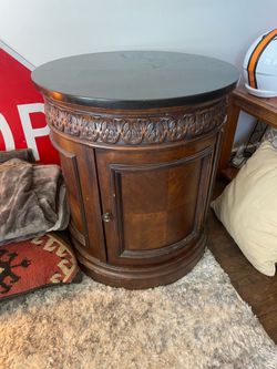Round wooden cabinet granite top