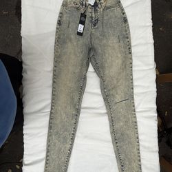 High-waisted acid-washed skinny jeans (XS)