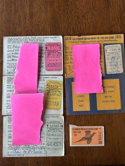 Vintage hunting licenses with stamps