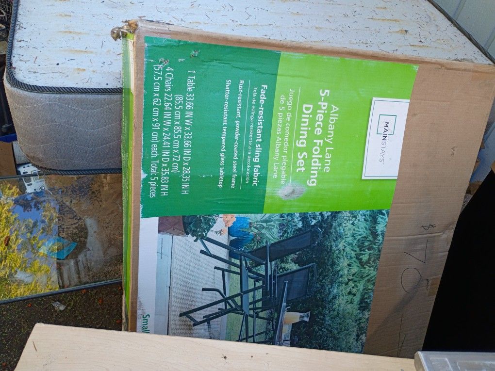A Five Piece Folding Dining Set Brand New