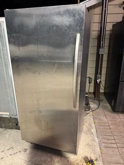 Whirlpool stainless steel stand up freezer with an ice maker