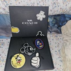 Coach Disney Limited Edition bag Charms Set If 4. Never Been Out Of The Box.