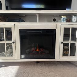 Farmhouse TV stand with a built-in electric fireplace