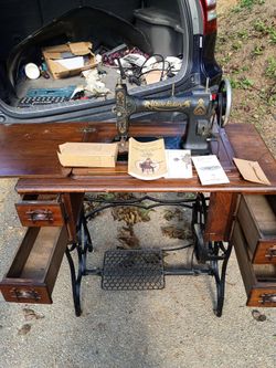White rotary sewing machine with all attachments and books