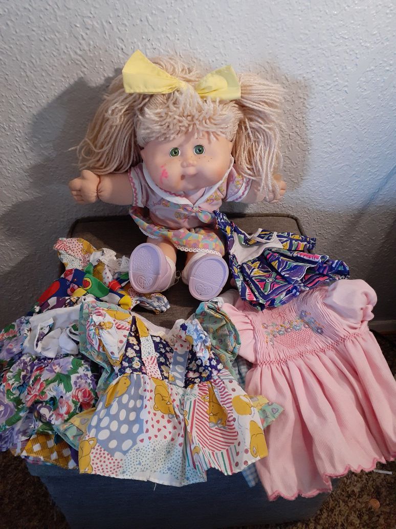 1995 Cabbage Patch Doll with 8 Dresses $25 firm