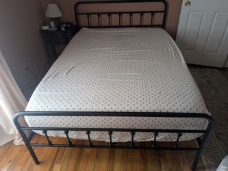 Black metal double bed frame