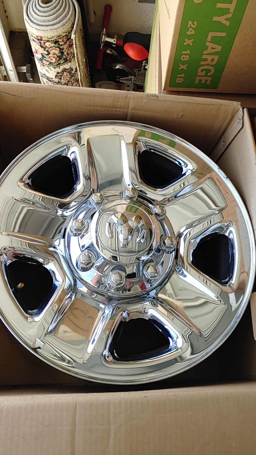 4 Dodge 18x8 rims. 8 lug as shown in photos.Includes center caps and lug nuts