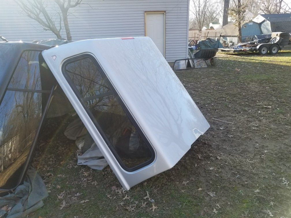 Dodge Dakota camper shell I have 2 one silver one black that out of a Dodge pickup short bed measurements are 62 inches bu 68 inches