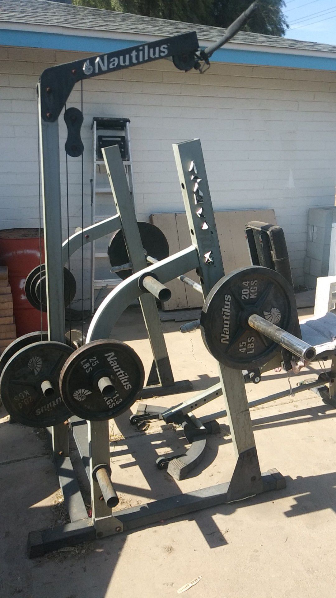 Weight set with curl bar bench press and rack with 250+ pounds of weight plates