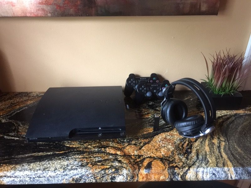 PS3 with 2 controllers and Bluetooth Sony headphones