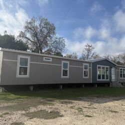 A spacious manufactured home double wide 4 bedroom 2 bathroom with a den